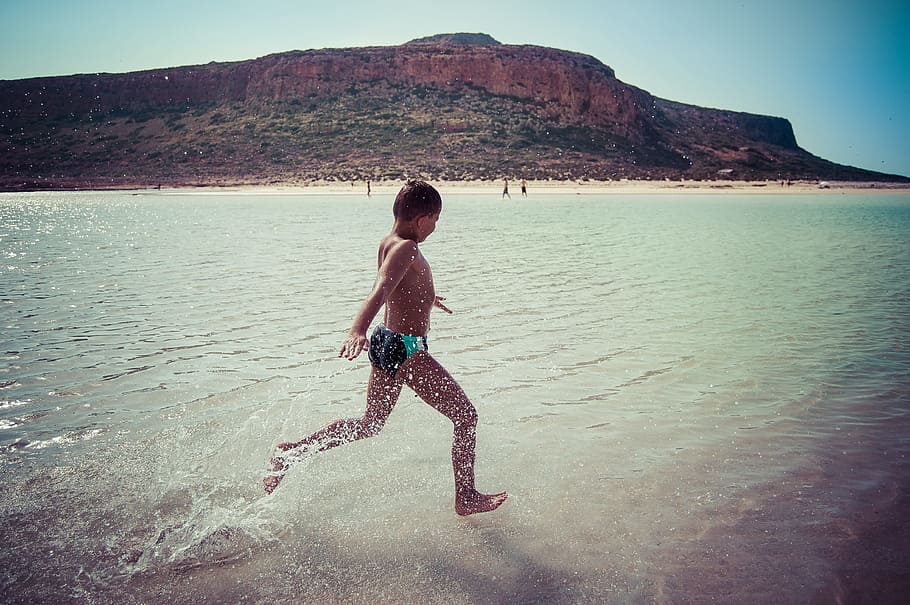 boy wearing brief running on seashore, child, fun, joy, beach HD wallpaper