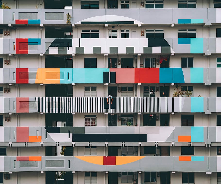 test card themed building, gray, and multicolored mid-rise building HD wallpaper