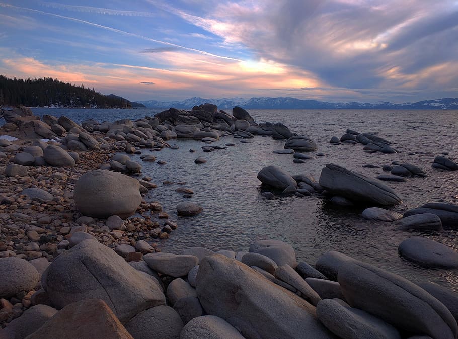 grey stones on seashore during golden hour time, dusk, lake, nature