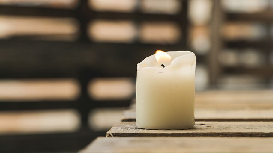 selective focus photography of white pillar canle, white flameless candle on board HD wallpaper