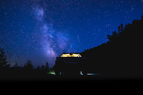 car parked in forest under starry sky, silhouette of vehicle under starry night HD wallpaper