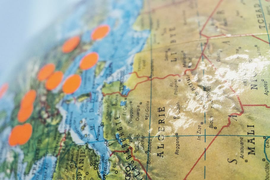 close-up photography of Alcerie globe map, dots, stickers, world HD wallpaper