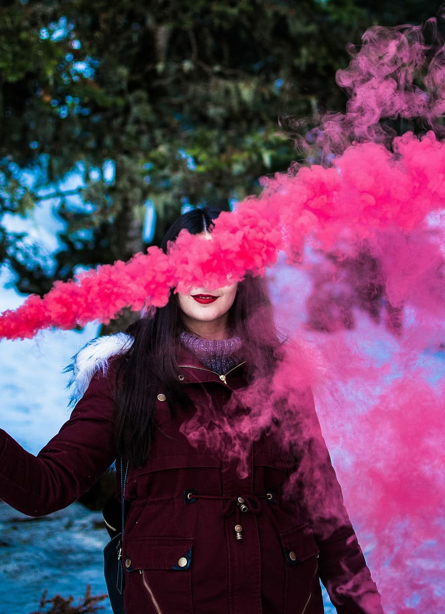 woman in red parka using smoke screen, pink smoke covering woman's face HD wallpaper