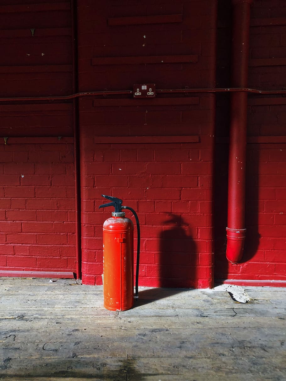 red fire extinguisher near red wall, red fire extinguisher on the floor HD wallpaper