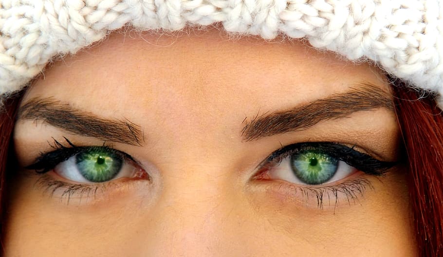 woman with green eyes wearing white crochet hat, iris, gene, seductive
