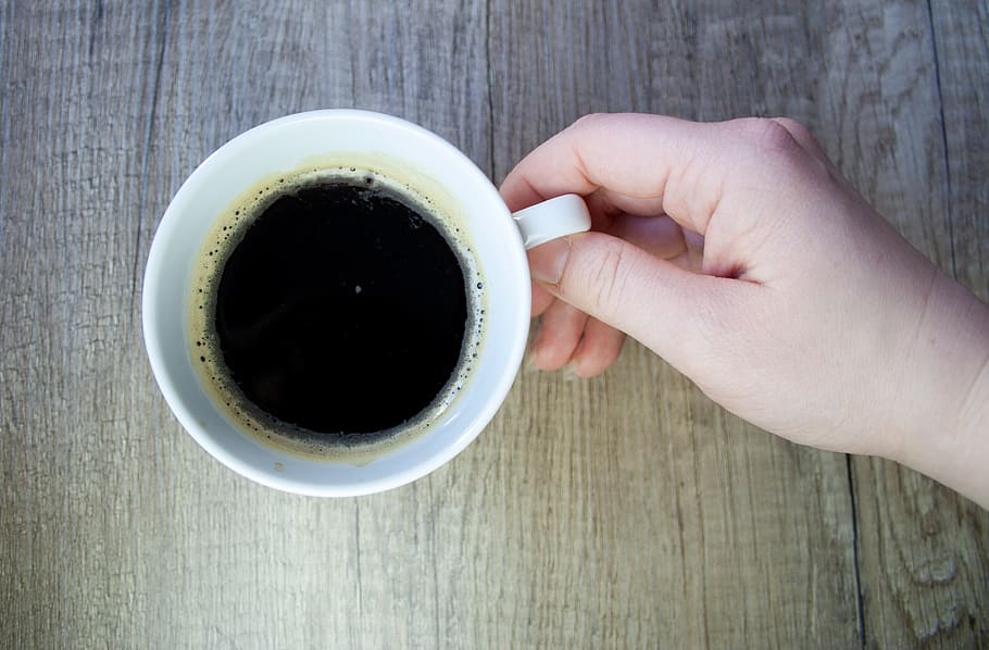 person holding white ceramic mug filled with black coffee, cup HD wallpaper
