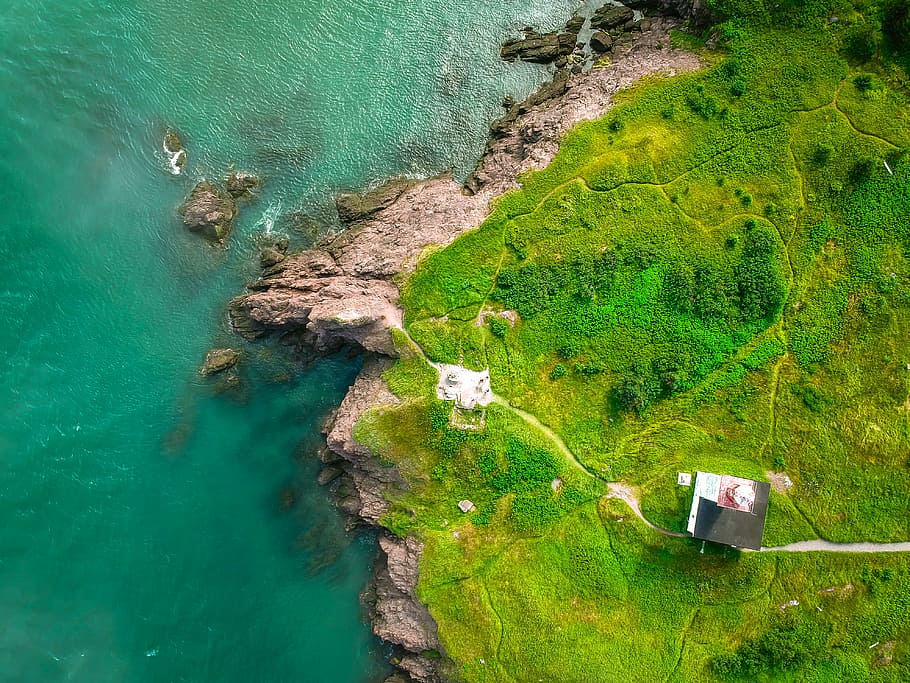 aerial photography of rocky mountain near sea, aerial view of house HD wallpaper