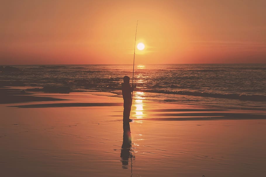 silhouette photo of person fishing on shore under dawn, sea HD wallpaper