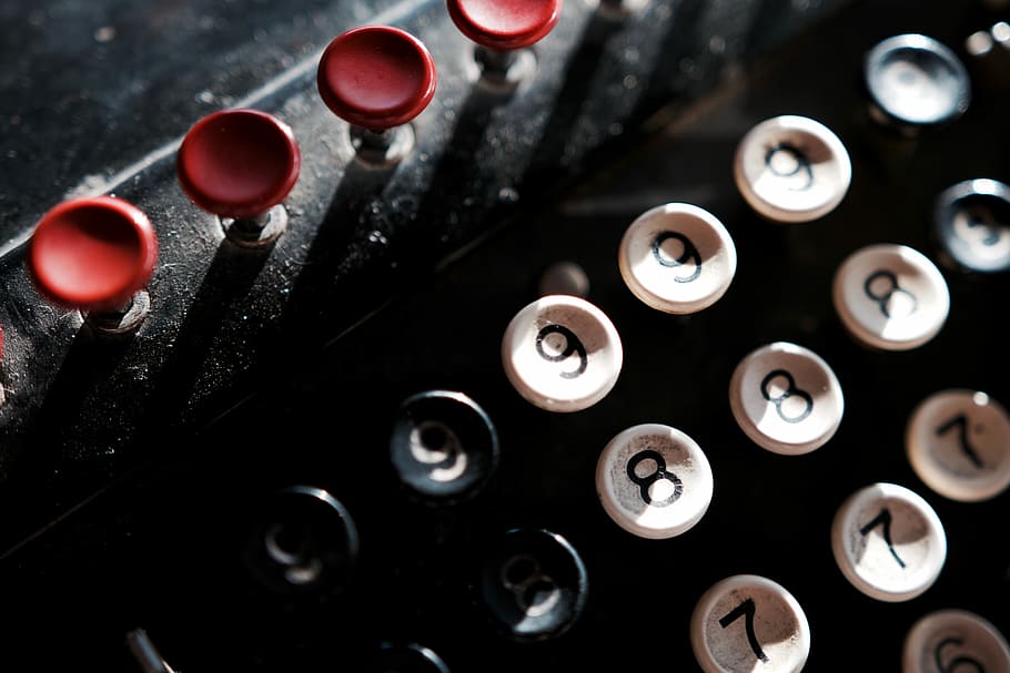 black and white typewriter buttons, top view of black typewriter