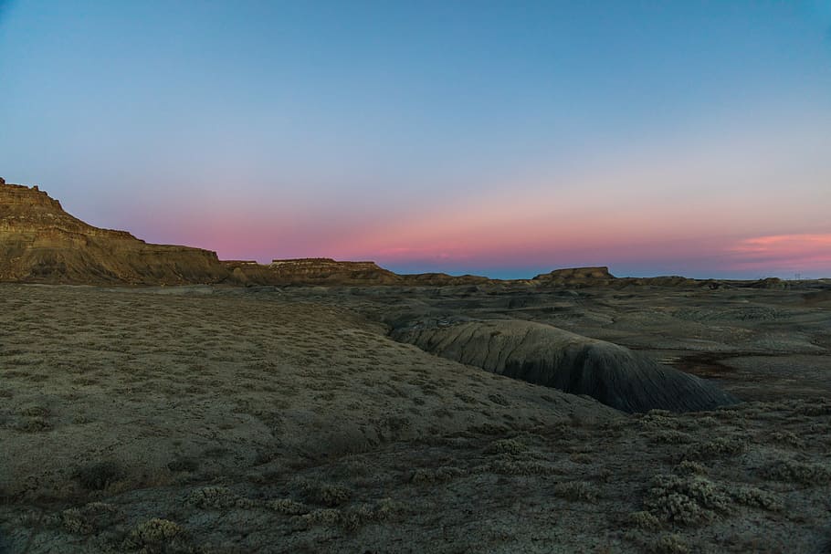 scenery of a dryland, rock formations in desert, mountain, sunset HD wallpaper