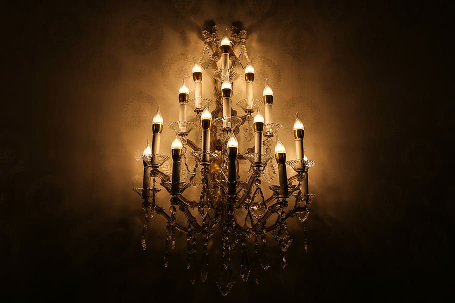 brown and crystal chandelier, gray uplight chandelier, dark, candlestick