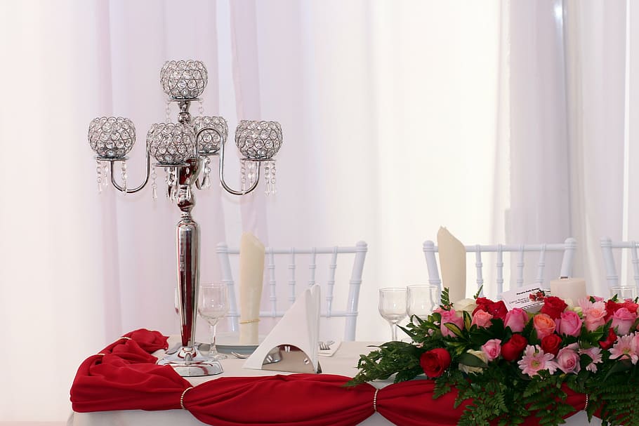 pink and red roses flower arrangement beside candle holder HD wallpaper