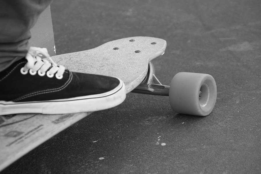person riding skateboard on gray concrete pavement, Black And White HD wallpaper