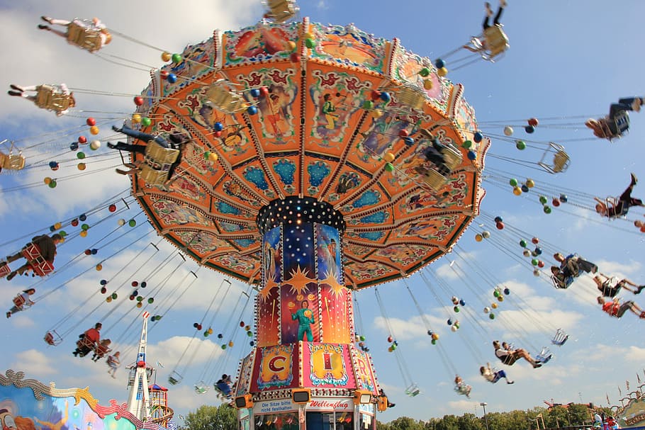 people in carnival ride during daytime, sky, carousel, entertainment