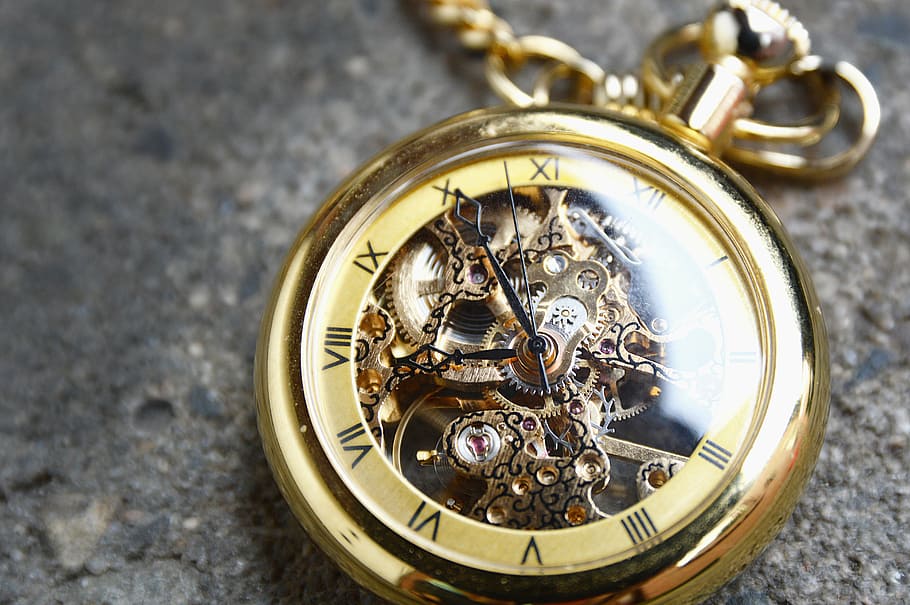 gold-colored skeleton pocket watch reading 7:50 time, clock, valuable