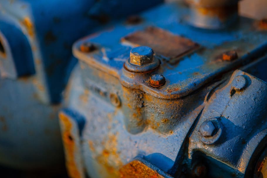 Close-up shot of a rusty blue-coloured engine. Image captured in Dungeness, Kent, England