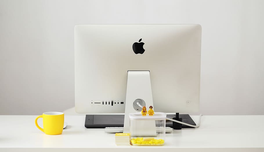 silver iMac beside yellow mug, silver iMac on white table beside yellow mug HD wallpaper