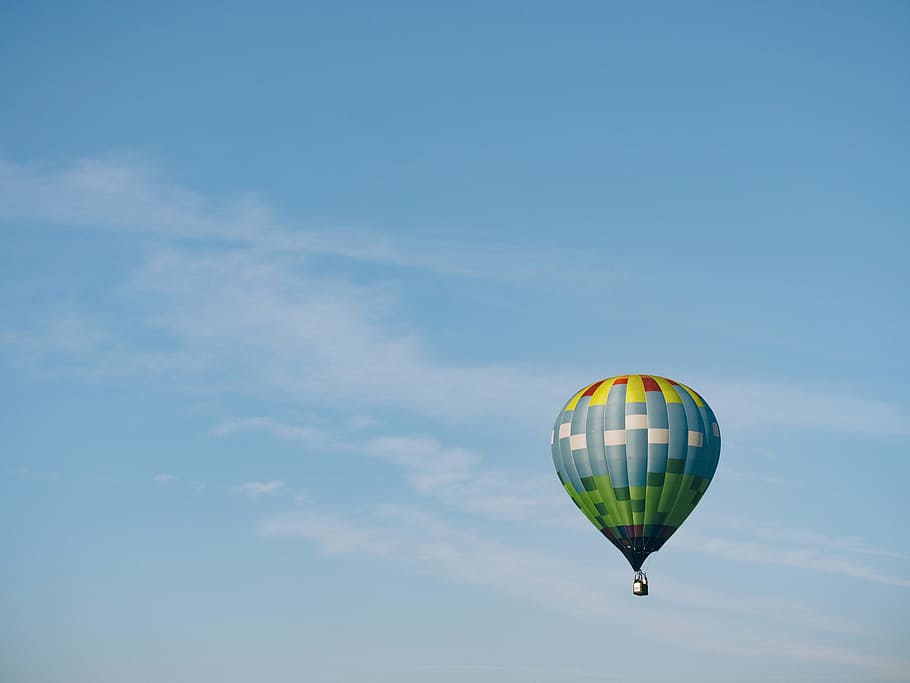 multi-colored hot air balloon flying on sky, blue hot air balloon in mid air HD wallpaper
