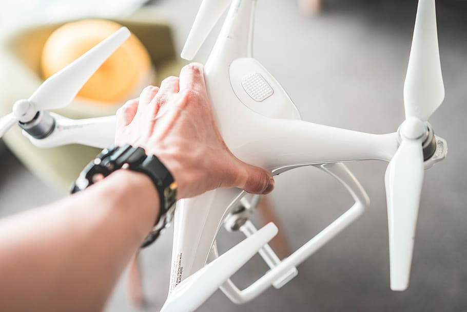 Man Holding a Drone in Hands, drone photography, drones, flying HD wallpaper