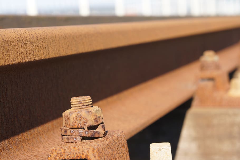 track, rails, rust, bolt, nut, no people, close-up, focus on foreground HD wallpaper