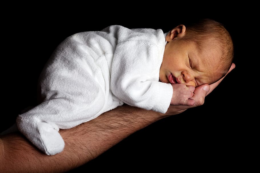 Baby in White Onesie Sleeping on Person's Hand, arm, child, close-up