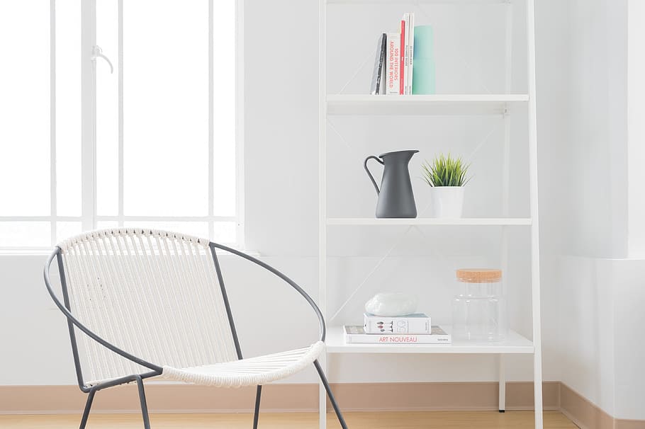white armchair with gray steel frame near white wooden 3-layer shelf HD wallpaper