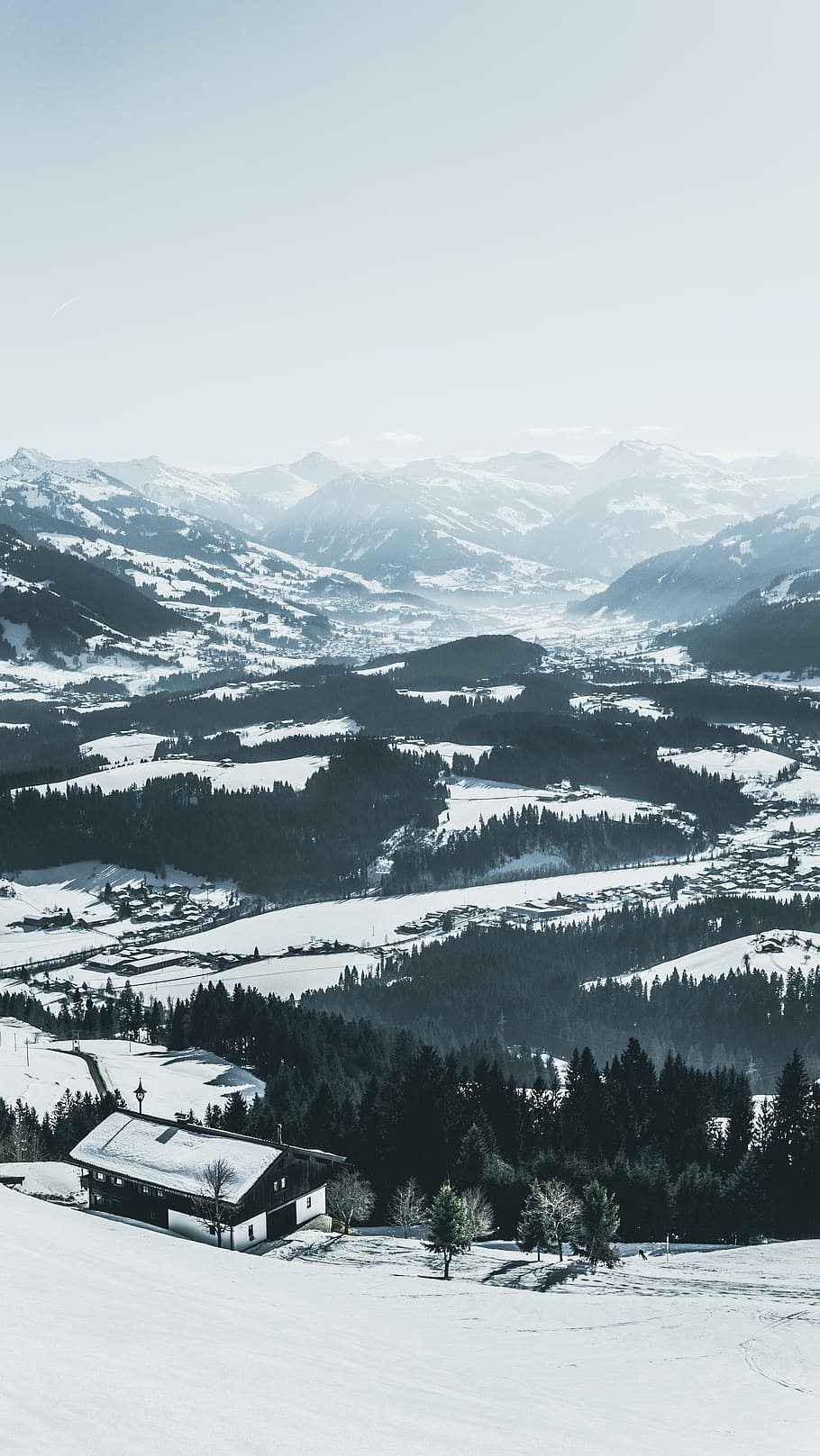 aerial photography of house rood and roads covered with snow at daytime, black and white house near forest covered with snow HD wallpaper