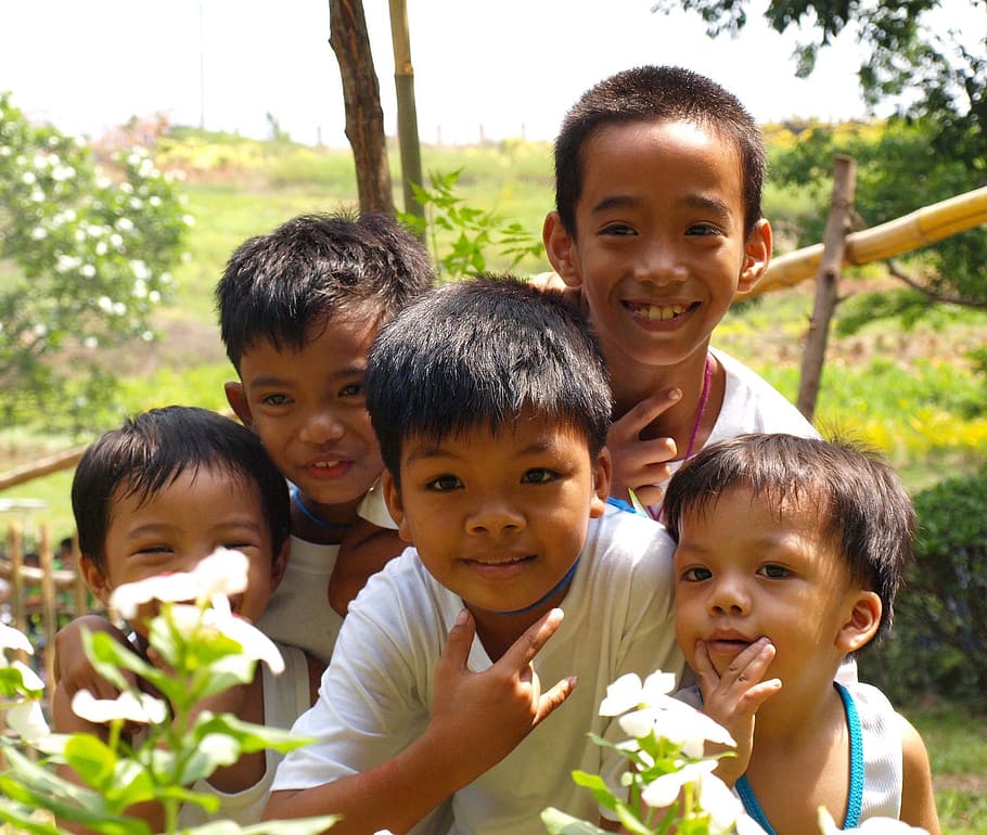children standing beside plants, Smiling, Asian, Filipino, outdoor