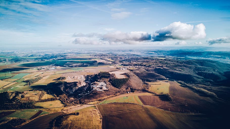 aerial photography of mountains under blue sky, top view of plain field HD wallpaper
