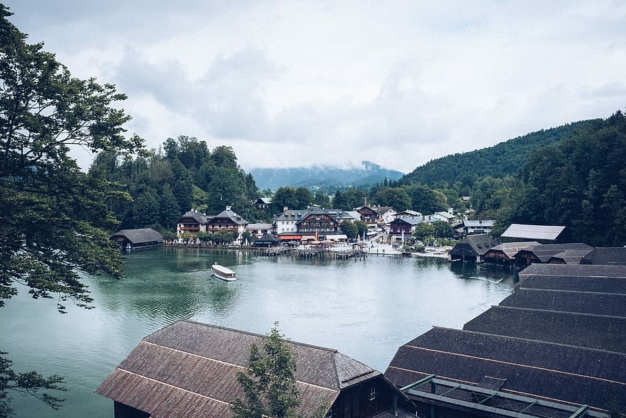 aerial shot of body of water, village near body of water under white sky HD wallpaper