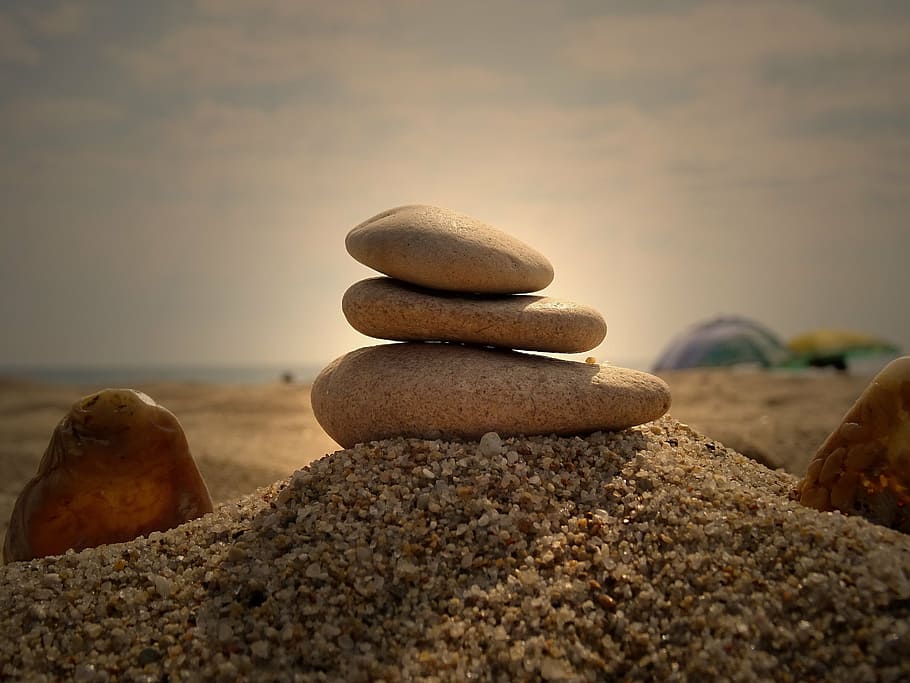 brown 3-layer balance stone on sand, sky, beach, travel, summer