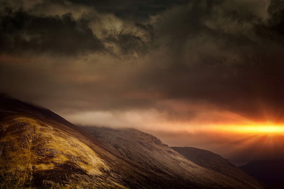 mountain and dark sky, landscape photography of a mountain during golden hour HD wallpaper