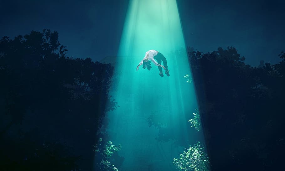 person floating in blue light, close encounters of the 3rd degree