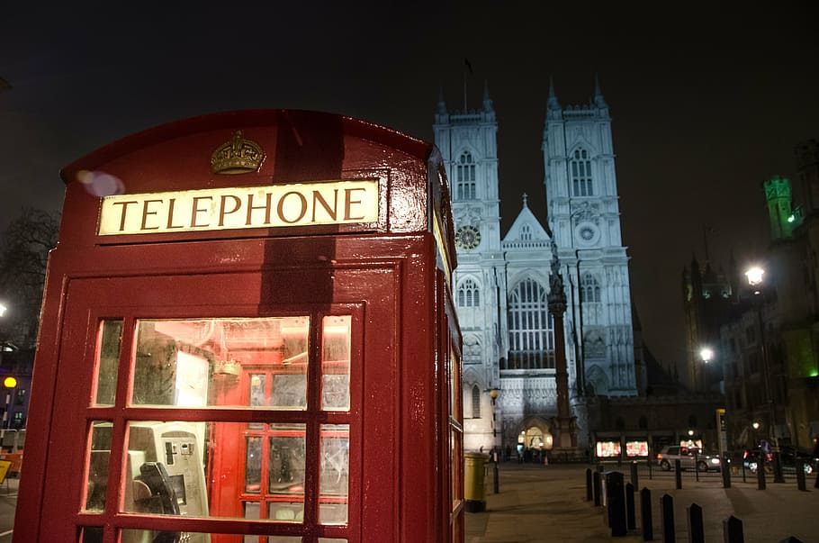 vacant red telephone booth at nighttime, london, england, box