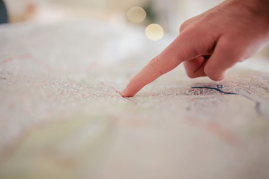 hand pointing on map, finger, human hand, human body part, selective focus HD wallpaper