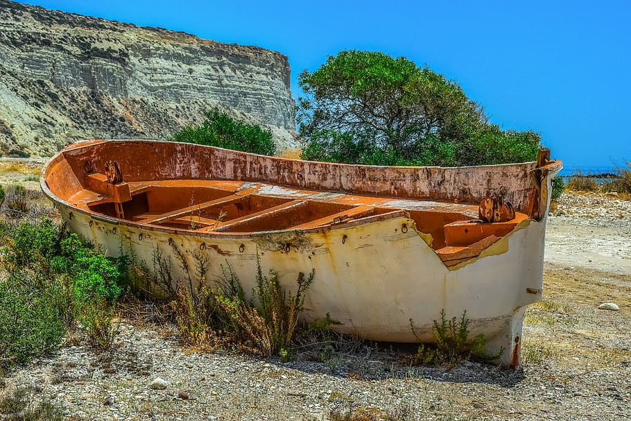 brown metal boat docked on gray land, weathered, aged, abandoned HD wallpaper
