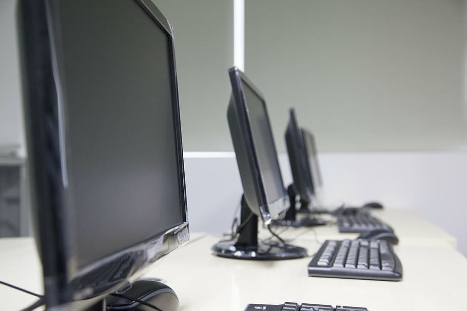 selective focus photography of flat screen monitors turned off HD wallpaper