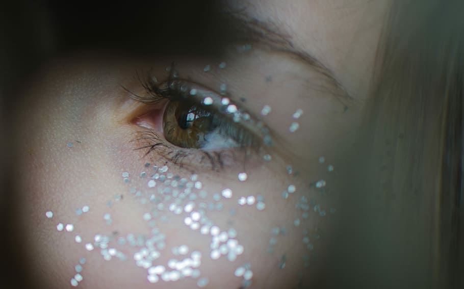 closeup photo of woman's left eye, woman cheeks with gray glitters HD wallpaper