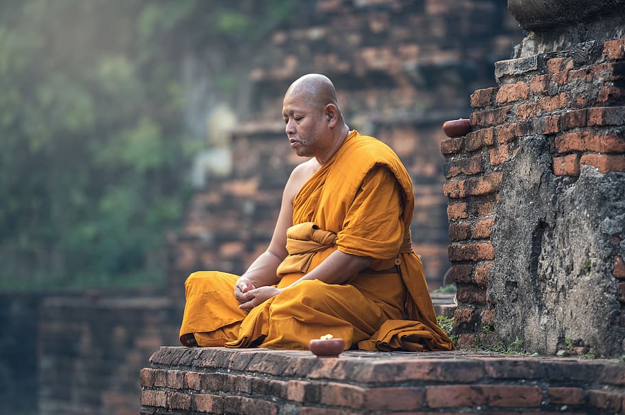 meditating monk on brown brick wall, adult, eat, ancient, asia