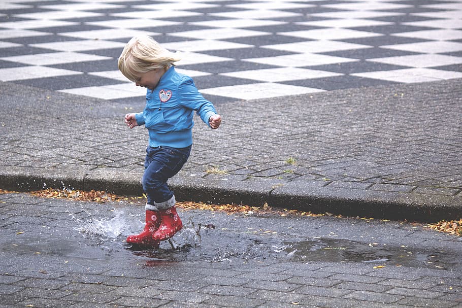 Boy in Blue Jacket Hopping on Water Puddle, child, jump, jumping, HD wallpaper