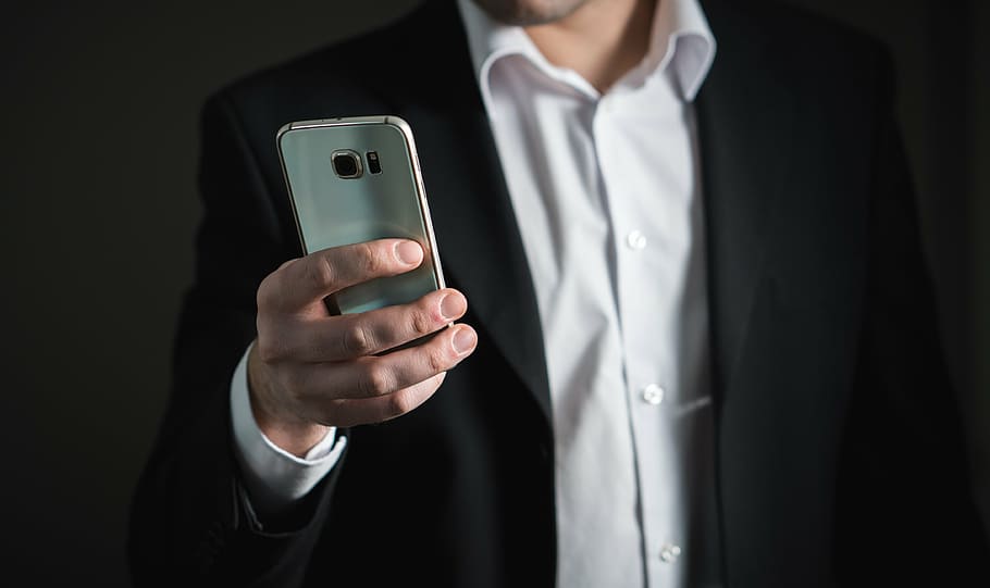 person holding silver Samsung Galaxy S6, businessman, smartphone