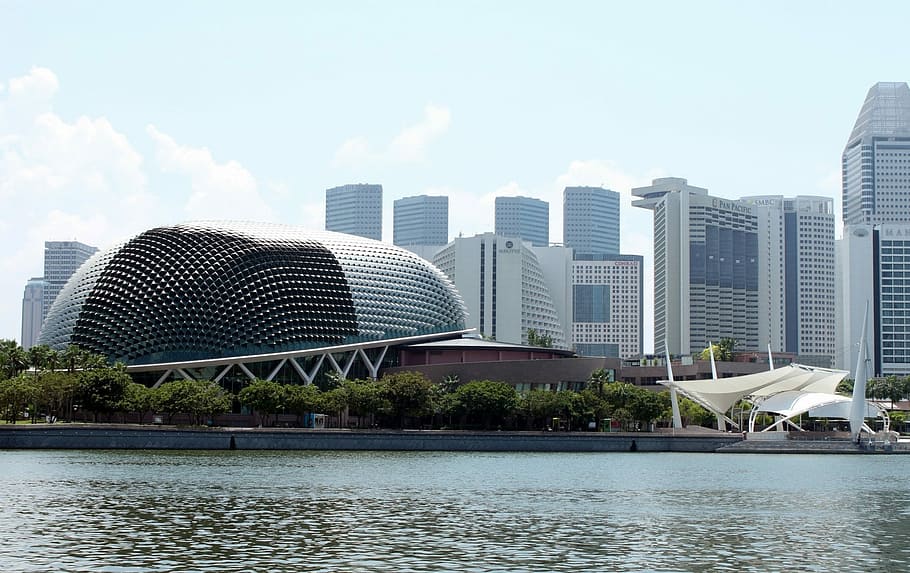 photo of architectural building near high-rise buildings during daytime HD wallpaper