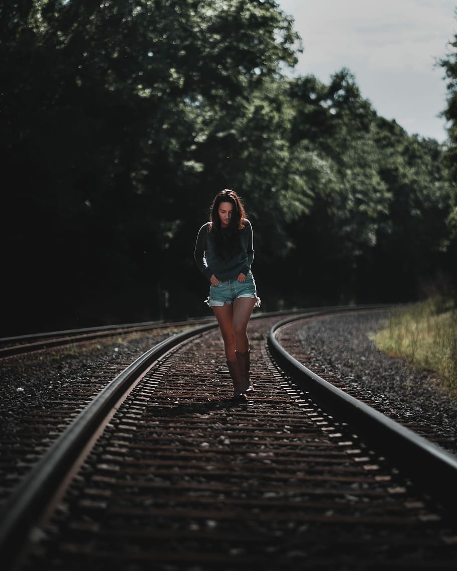 photo of woman standing on railroad, woman in gray sweater walking on train rail, HD wallpaper