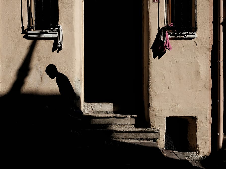 silhouette of person beside door, person standing near brown painted doorway HD wallpaper