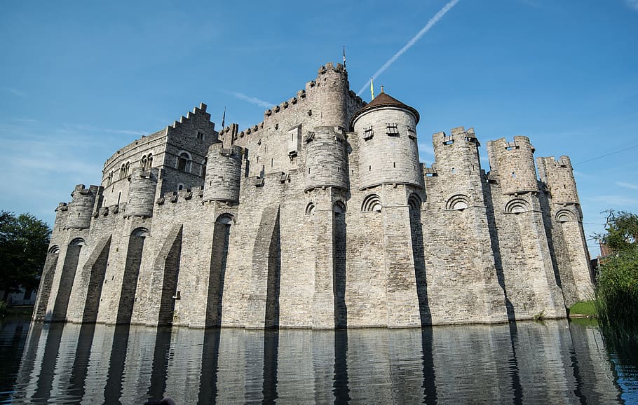 gray castle near body of water under blue sky at daytime, Ghent