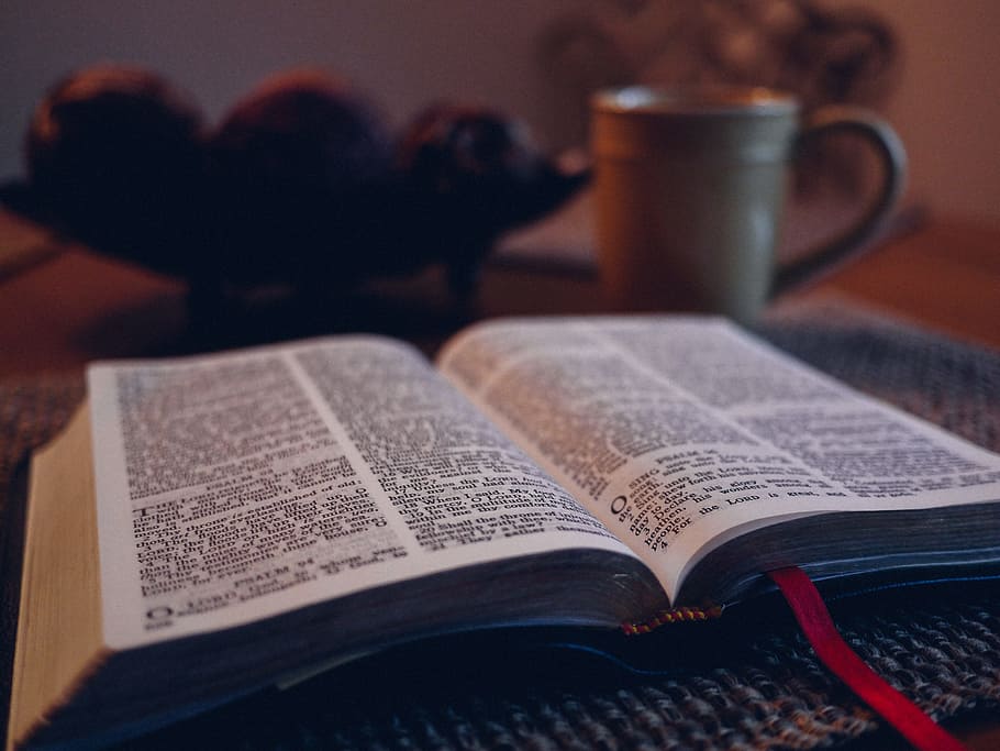 open book on black mat beside grey ceramic mug, white open book near gray ceramic mug HD wallpaper