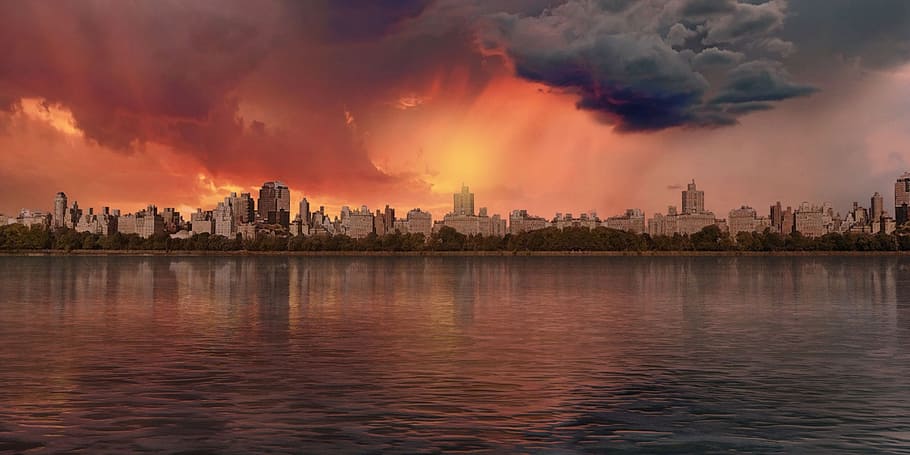 landscape photography of high rise building and body of water HD wallpaper