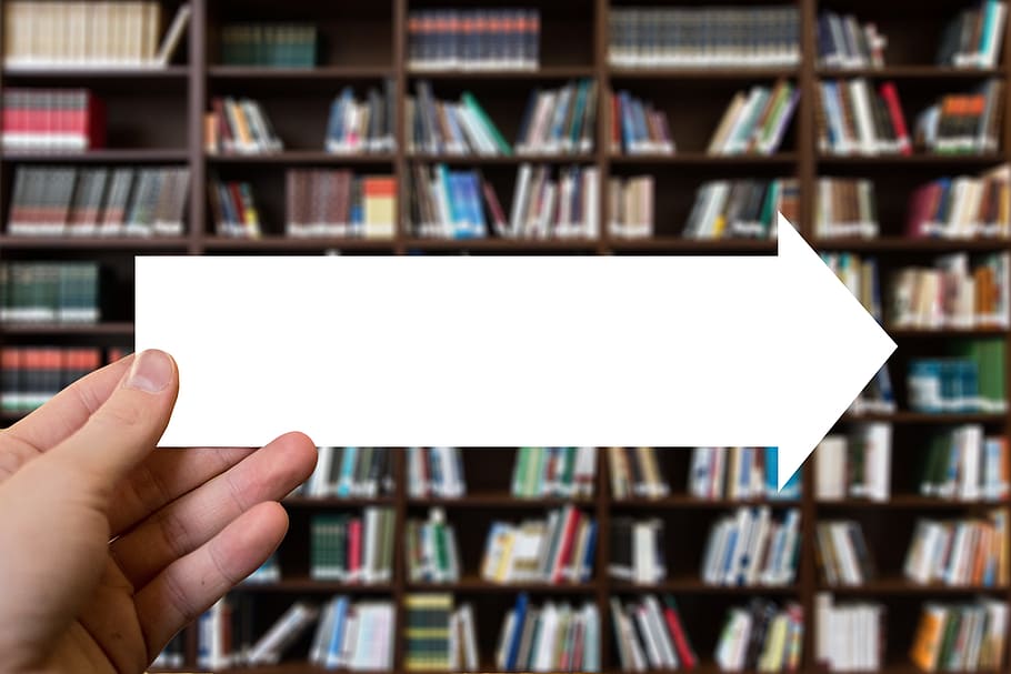 person holding arrow right paper, books, hand, keep, direction HD wallpaper