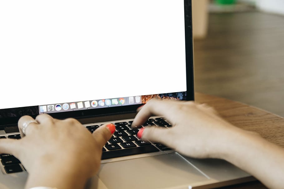 person using MacBook on table, laptop, apple, keyboard, technology HD wallpaper