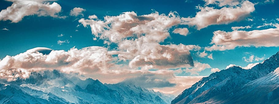 mountain range under partially cloudy skies, white clouds, blue sky HD wallpaper